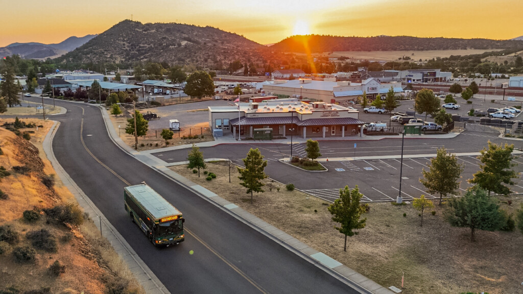 Siskiyou County Transit Center with setting sun over the mountains in the background.