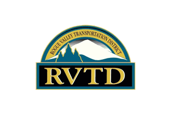 Rogue Valley Transportation District (RVTD) logo featuring mountains, a sunrise, and the initials RVTD in gold on a dark background.